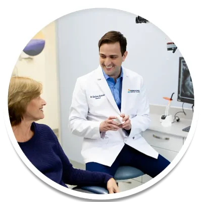 Dr Gustavo is one of the best dentist in ottawa, in this picture with a patient at Horizons Dental Care
